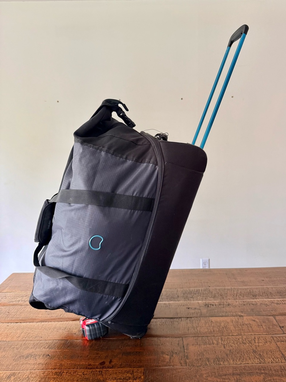 Delsey Paris Rolling Travel Duffel Bag with Handle Accents